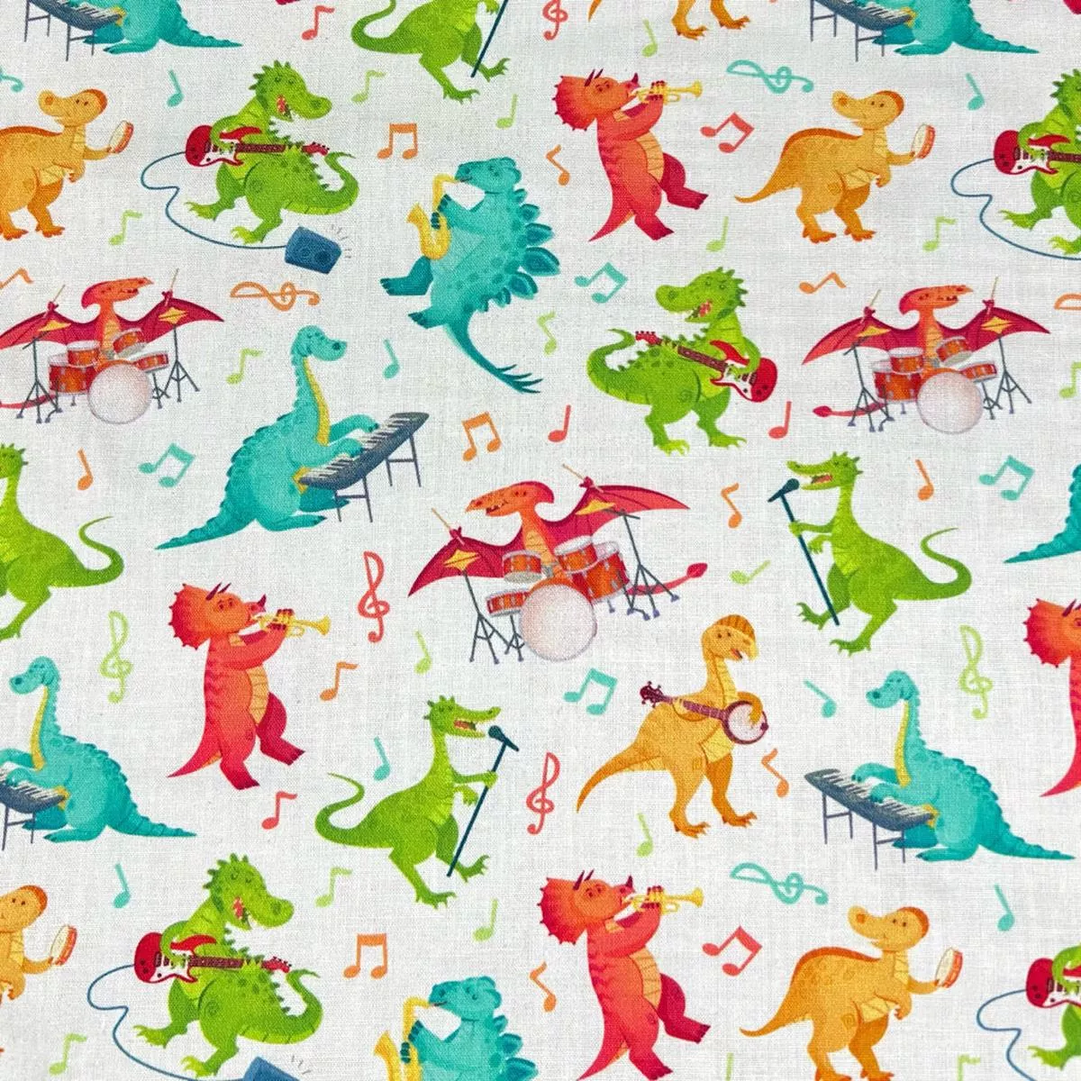 dino-tunes-on-ivory-cotton-fabric Dino Tunes on Ivory Cotton Fabric