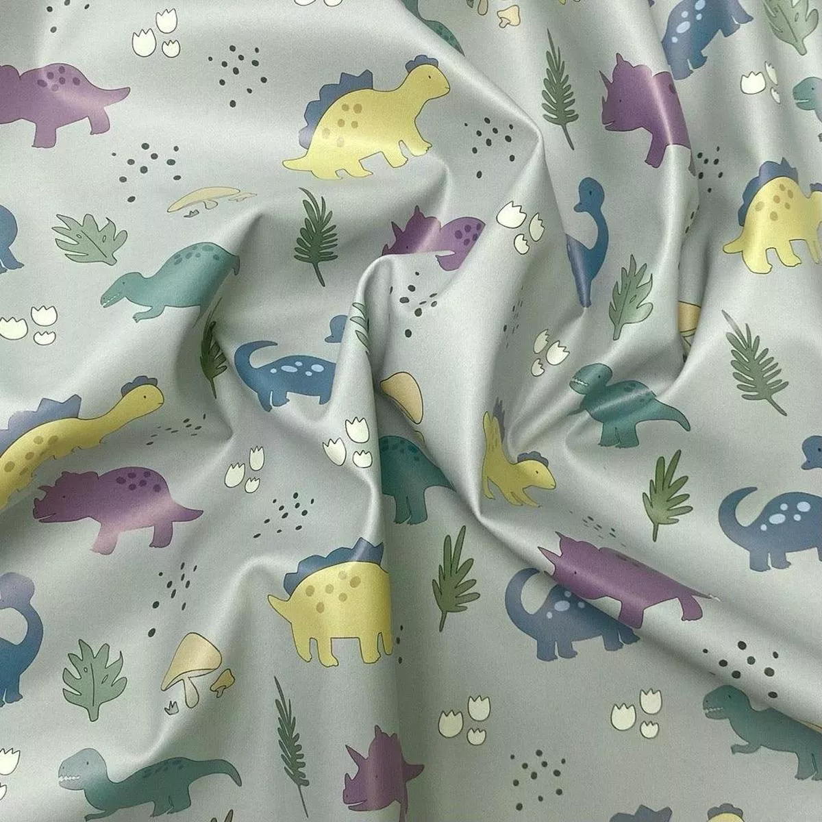 dinosaurs-on-pale-green-raincoat-fabric Dinosaurs on Pale Green Raincoat Fabric